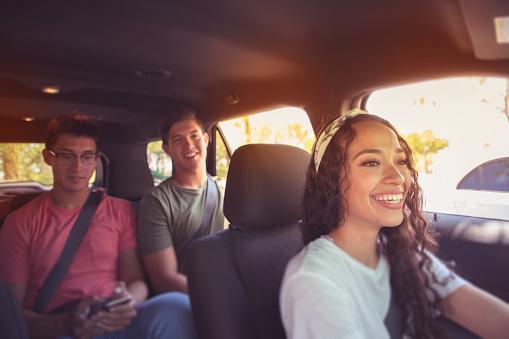 3 young people in a car